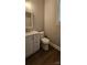 Bathroom with a modern vanity, toilet, and dark-toned vinyl flooring at 2828 Bellhaven Cir, Charlotte, NC 28214
