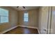 Bedroom with neutral walls, a ceiling fan, two windows, and modern vinyl flooring at 2828 Bellhaven Cir, Charlotte, NC 28214