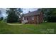 Quaint brick home boasting a tidy lawn and an inviting front entrance at 2828 Bellhaven Cir, Charlotte, NC 28214