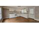 Updated kitchen with white cabinets, modern appliances, and plenty of natural light at 2828 Bellhaven Cir, Charlotte, NC 28214