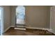 Living room with archway view of an updated kitchen with white appliances at 2828 Bellhaven Cir, Charlotte, NC 28214