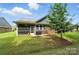 Enjoy outdoor living with a screened in back porch, patio, grill, and a private backyard space at 3029 Marchers Trace Dr, Charlotte, NC 28227