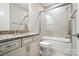 Well-lit bathroom featuring granite counters, white cabinetry, and glass enclosed shower and tub at 3029 Marchers Trace Dr, Charlotte, NC 28227