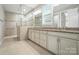 Modern bathroom featuring double vanity, large mirror, tiled floors, and walk-in shower at 3029 Marchers Trace Dr, Charlotte, NC 28227