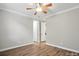 Bedroom featuring hardwood floors and an open doorway leading to other rooms at 3029 Marchers Trace Dr, Charlotte, NC 28227