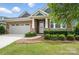 Charming front exterior featuring well-kept landscaping and a welcoming entryway at 3029 Marchers Trace Dr, Charlotte, NC 28227