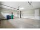 Spacious two-car garage with epoxy flooring, ample space for vehicles and storage with overhead lighting at 3029 Marchers Trace Dr, Charlotte, NC 28227