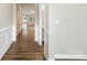 Inviting hallway with hardwood floors leading to a bright and open living space at 3029 Marchers Trace Dr, Charlotte, NC 28227