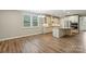 Open floor plan of kitchen showcasing white cabinetry, granite countertops, and stainless steel appliances at 3029 Marchers Trace Dr, Charlotte, NC 28227