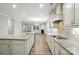 Open-concept kitchen featuring a large island, granite countertops, stainless steel appliances, and a view of the living room at 3029 Marchers Trace Dr, Charlotte, NC 28227