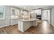 A spacious kitchen featuring custom cabinets, stainless steel appliances, and a granite countertop island at 3029 Marchers Trace Dr, Charlotte, NC 28227