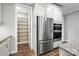 This kitchen offers stainless steel appliances and a large pantry with multiple shelves for optimal storage at 3029 Marchers Trace Dr, Charlotte, NC 28227