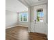 Versatile room with hardwood floors, natural light, and a view to the front door at 3029 Marchers Trace Dr, Charlotte, NC 28227