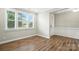 Bright room with hardwood floors, natural light from three windows and view to the front door at 3029 Marchers Trace Dr, Charlotte, NC 28227