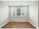 Bright room with hardwood floors and three windows offering ample natural light at 3029 Marchers Trace Dr, Charlotte, NC 28227