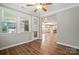 Cozy sunroom with plenty of windows, a ceiling fan, and access to the backyard at 3029 Marchers Trace Dr, Charlotte, NC 28227