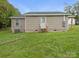 Back of single-story house showing access stairs and a clean exterior at 313 S Park Dr, Wadesboro, NC 28170