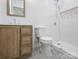 Bathroom features wooden vanity, toilet, and shower at 313 S Park Dr, Wadesboro, NC 28170