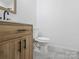 Bathroom features wooden vanity and toilet at 313 S Park Dr, Wadesboro, NC 28170