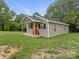 Quaint single-story house featuring a covered porch and a well-maintained lawn at 313 S Park Dr, Wadesboro, NC 28170