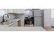 Modern kitchen featuring stainless steel appliances and stylish backsplash at 313 S Park Dr, Wadesboro, NC 28170