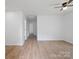 Open floor plan living room features wood floors and natural light at 313 S Park Dr, Wadesboro, NC 28170