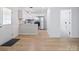 View of kitchen and bathroom, with wood floors at 313 S Park Dr, Wadesboro, NC 28170