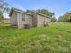 Back of a single-story home with a view of the backyard space at 313 S Park Dr, Wadesboro, NC 28170