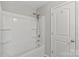 Bathroom features a tub-shower with a shower head and white surround, plus a white door at 329 Brannon Meadows Dr, York, SC 29745