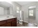 Bathroom featuring a wood vanity with a white countertop, plus tile flooring and a large mirror at 329 Brannon Meadows Dr, York, SC 29745