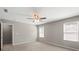 This bedroom features neutral carpeting and paint, a ceiling fan, and natural light from two windows at 329 Brannon Meadows Dr, York, SC 29745