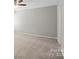 Bedroom with neutral carpeting and paint, plus a ceiling fan and a bright window at 329 Brannon Meadows Dr, York, SC 29745