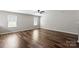 Spacious bedroom featuring sleek wood floors, neutral paint, and natural light from two windows at 329 Brannon Meadows Dr, York, SC 29745