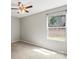Bedroom with a ceiling fan and a window providing natural light, carpeted floor and gray walls at 329 Brannon Meadows Dr, York, SC 29745