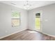 Bright dining area features hardwood floors, modern lighting, and easy access to the backyard through a glass door at 329 Brannon Meadows Dr, York, SC 29745
