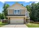 Charming two-story home featuring a two-car garage, landscaped yard, and neutral siding at 329 Brannon Meadows Dr, York, SC 29745