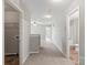 Upstairs hallway with carpet floor and easy access to the utility room and a full bathroom at 329 Brannon Meadows Dr, York, SC 29745