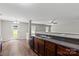 Modern kitchen boasts stainless steel appliances, wood cabinets, and seamless flow into the living area, perfect for entertaining at 329 Brannon Meadows Dr, York, SC 29745