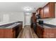 Well-equipped kitchen features sleek countertops, dark wood cabinetry, and modern appliances for convenient meal preparation at 329 Brannon Meadows Dr, York, SC 29745