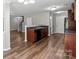 Open kitchen featuring sleek wood floors, dark wood cabinets, and stainless steel appliances at 329 Brannon Meadows Dr, York, SC 29745