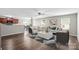 Open-concept living room featuring a stylish sofa, chairs, and sleek hardwood floors at 329 Brannon Meadows Dr, York, SC 29745