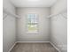 Walk-in closet featuring wire shelving and a window providing ample natural light at 329 Brannon Meadows Dr, York, SC 29745