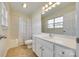 Bathroom featuring tile floors, a shower/tub combo, and a vanity with a large mirror at 349 Valley Brook Se Ln, Concord, NC 28025