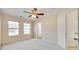 Bright bedroom features two windows, neutral carpet and a ceiling fan at 349 Valley Brook Se Ln, Concord, NC 28025