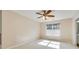Cozy bedroom featuring carpet, window, and ceiling fan at 349 Valley Brook Se Ln, Concord, NC 28025