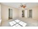 Spacious bedroom with carpet, ceiling fan, and natural light at 349 Valley Brook Se Ln, Concord, NC 28025
