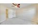 Bedroom with neutral walls, carpet, a ceiling fan, and double door closet at 349 Valley Brook Se Ln, Concord, NC 28025