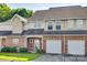 Exterior of townhome featuring brick accents, and attached garages at 349 Valley Brook Se Ln, Concord, NC 28025