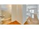 Hallway featuring a half bath, wood floors, and neutral paint at 349 Valley Brook Se Ln, Concord, NC 28025