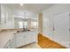 Bright kitchen flows into a dining area and staircase at 349 Valley Brook Se Ln, Concord, NC 28025